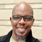 Corey E Smith