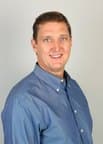 MARK D. TOMICH